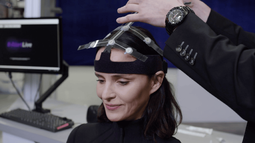 Woman having neurotesting equipment applied